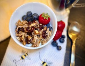 Granola made of nuts on yogurt with fresh fruit